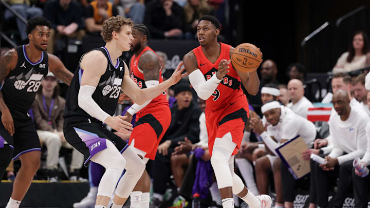 Mar 14, 2025; Salt Lake City, Utah, USA;  Toronto Raptors guard RJ Barrett (9) passes the ball away from Utah Jazz forward Lauri Markkanen (23) during the second quarter at Delta Center. Mandatory Credit: Chris Nicoll-Imagn Images