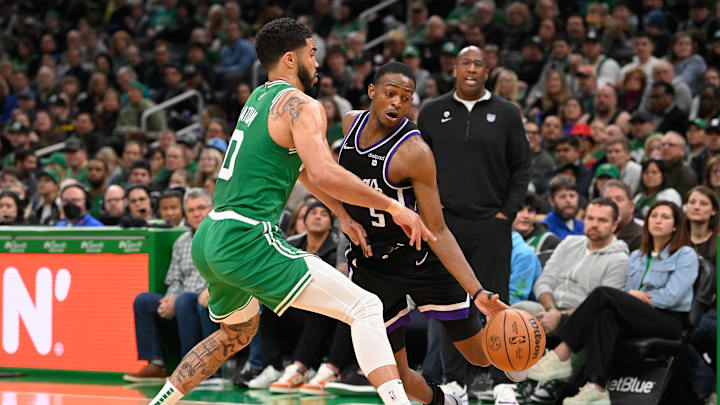 Apr 5, 2024; Boston, Massachusetts, USA; Boston Celtics forward Jayson Tatum (0) defends against Sacramento Kings guard De'Aaron Fox (5) during the second half at TD Garden. Mandatory Credit: Eric Canha-Imagn Images Apr 5, 2024; Boston, Massachusetts, USA; Boston Celtics forward Jayson Tatum (0) defends against Sacramento Kings guard De'Aaron Fox (5) during the second half at TD Garden. Mandatory Credit: Eric Canha-Imagn Images