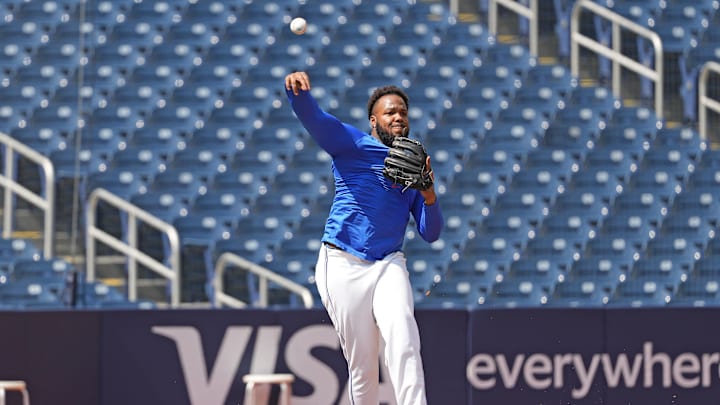 Sep 4, 2024; Toronto, Ontario, CAN; Toronto Blue Jays first baseman Vladimir Guerrero Jr. (27) throws a ball to first base during batting practice before game against the Philadelphia Phillies at Rogers Centre.