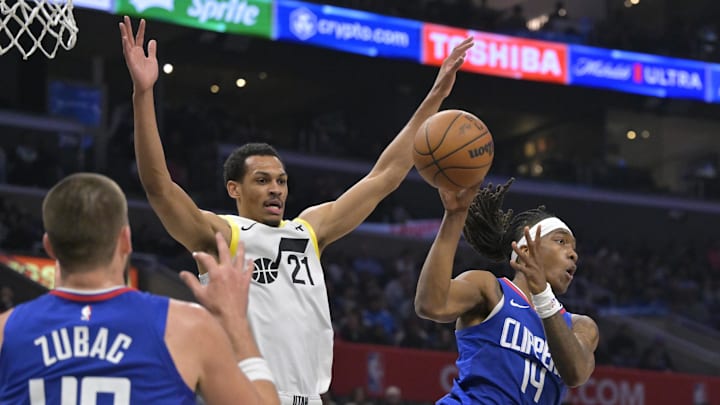 Apr 5, 2024; Los Angeles, California, USA; Los Angeles Clippers guard Terance Mann (14) is defended