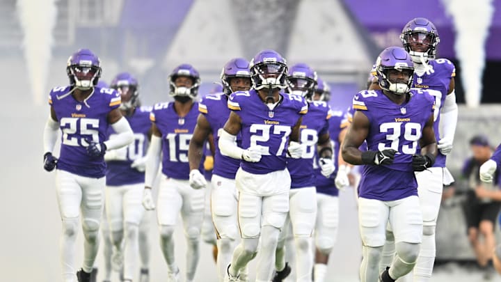Aug 19, 2023; Minneapolis, Minnesota, USA; Minnesota Vikings linebacker Abraham Beauplan (39) and cornerback Kalon Barnes (27) and safety Theo Jackson (25) lead the team onto the field before the game against the Tennessee Titans at U.S. Bank Stadium. Mandatory Credit: Jeffrey Becker-Imagn Images