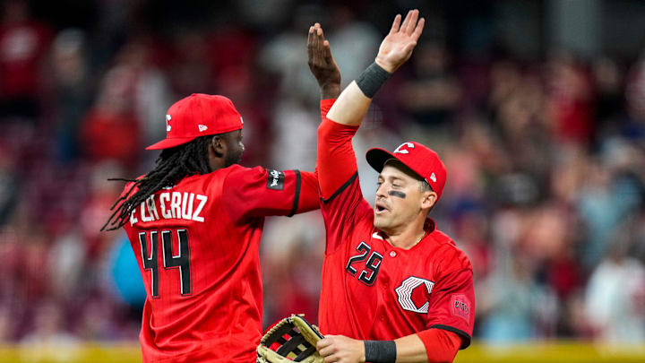 Cincinnati Reds shortstop Elly de la Cruz (44) and center fielder TJ Friedl (29) celebrate a win after the ninth inning of the MLB Interleague game between the Cincinnati Reds and the Detroit Tigers at Great American Ball Park in downtown Cincinnati on Saturday, April 25, 2026. The Reds won the second game of the series, 9-2.