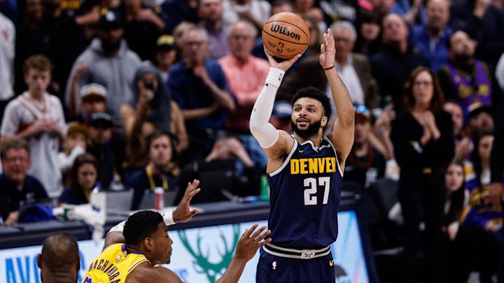 Apr 29, 2024; Denver, Colorado, USA; Denver Nuggets guard Jamal Murray (27) takes a shot against Los Angeles Lakers forward Rui Hachimura (28) in the fourth quarter during game five of the first round for the 2024 NBA playoffs at Ball Arena. Mandatory Credit: Isaiah J. Downing-Imagn Images