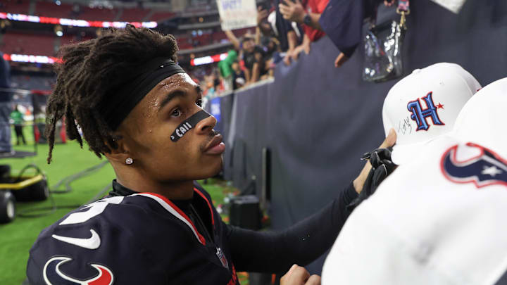 Dec 15, 2024; Houston, Texas, USA; Houston Texans wide receiver Tank Dell (3) signs autographs after defeating the Miami Dolphins at NRG Stadium. Mandatory Credit: Thomas Shea-Imagn Images Dec 15, 2024; Houston, Texas, USA; Houston Texans wide receiver Tank Dell (3) signs autographs after defeating the Miami Dolphins at NRG Stadium. Mandatory Credit: Thomas Shea-Imagn Images