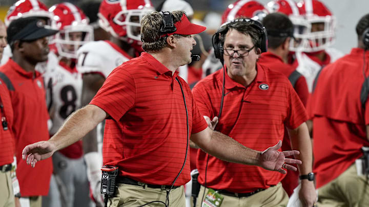 Georgia Bulldogs head coach Kirby Smart and assistant coach Will Muschamp