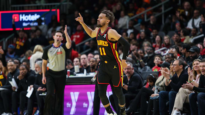 Nov 29, 2024; Atlanta, Georgia, USA; Atlanta Hawks guard Trae Young (11) celebrates shot against the Cleveland Cavaliers during the fourth quarter at State Farm Arena. Mandatory Credit: Jordan Godfree-Imagn Images