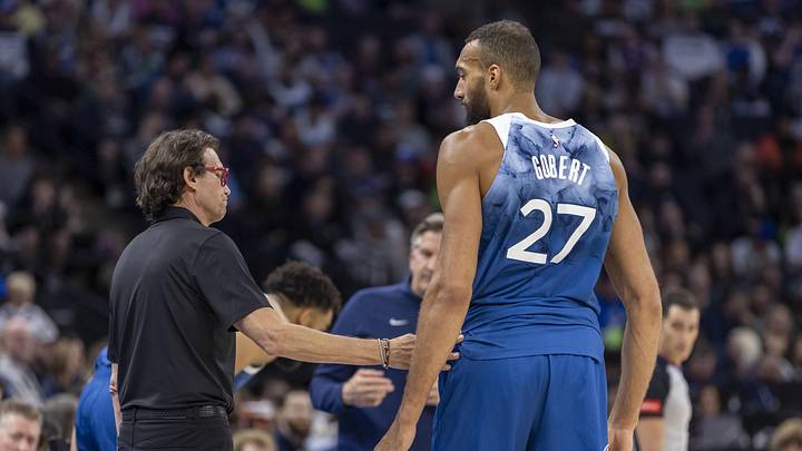 Apr 12, 2024; Minneapolis, Minnesota, USA; Atlanta Hawks head coach Quin Snyder and Minnesota Timberwolves center Rudy Gobert (27) talk during a break from play in the first half at Target Center. Mandatory Credit: Jesse Johnson-Imagn Images