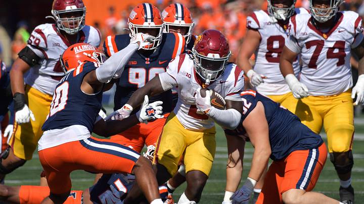Sep 27, 2025; Champaign, Illinois, USA; Southern California Trojans running back Waymond Jordan (2) runs through the Illinois Fighting Illini defensive line during the second half at Memorial Stadium. Mandatory Credit: Ron Johnson-Imagn Images Sep 27, 2025; Champaign, Illinois, USA; Southern California Trojans running back Waymond Jordan (2) runs through the Illinois Fighting Illini defensive line during the second half at Memorial Stadium. Mandatory Credit: Ron Johnson-Imagn Images