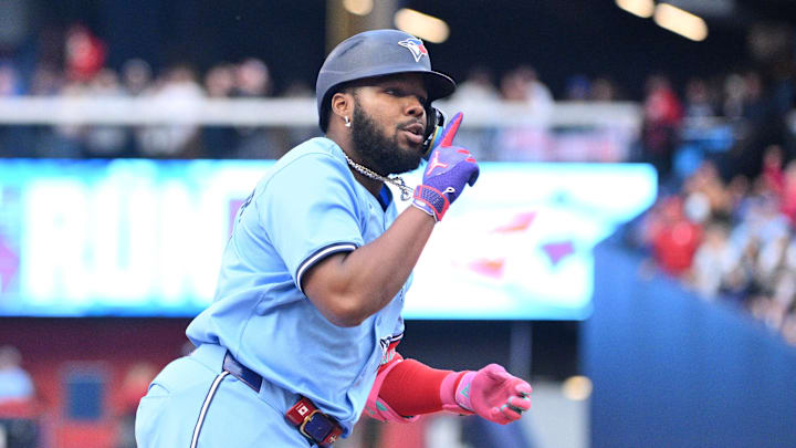 Toronto Blue Jays designated hitter Vladimir Guererro Jr. (27) gestures toward teammates after hitting a solo home run against the Cincinnati Reds in the first inning at Rogers Centre. 