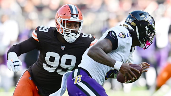Oct 27, 2024; Cleveland, Ohio, USA; Cleveland Browns defensive end Za'Darius Smith (99) sacks Baltimore Ravens quarterback Lamar Jackson (8) during the second half at Huntington Bank Field. Mandatory Credit: Ken Blaze-Imagn Images Oct 27, 2024; Cleveland, Ohio, USA; Cleveland Browns defensive end Za'Darius Smith (99) sacks Baltimore Ravens quarterback Lamar Jackson (8) during the second half at Huntington Bank Field. Mandatory Credit: Ken Blaze-Imagn Images