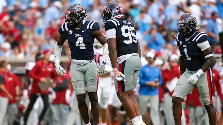 Oct 26, 2024; Oxford, Mississippi, USA; Mississippi Rebels linebacker Suntarine Perkins (4), defensive lineman Princely Umanmielen (1) and defensive lineman Akelo Stone (95) reacts after a sack during the second half against the Oklahoma Sooners at Vaught-Hemingway Stadium. Mandatory Credit: Petre Thomas-Imagn Images Oct 26, 2024; Oxford, Mississippi, USA; Mississippi Rebels linebacker Suntarine Perkins (4), defensive lineman Princely Umanmielen (1) and defensive lineman Akelo Stone (95) reacts after a sack during the second half against the Oklahoma Sooners at Vaught-Hemingway Stadium. Mandatory Credit: Petre Thomas-Imagn Images