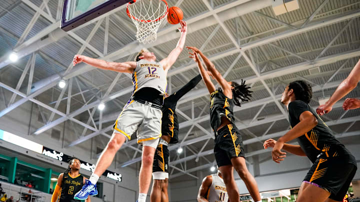 Montverde Academy Eagles forward Trent Sisley (12) tries to tip the ball into the basket during the fourth quarter of the City of Palms Classic semifinal game against the Oak Ridge Pioneers at Suncoast Credit Union Arena in Fort Myers, Fla., on Saturday, Dec. 21, 2024.