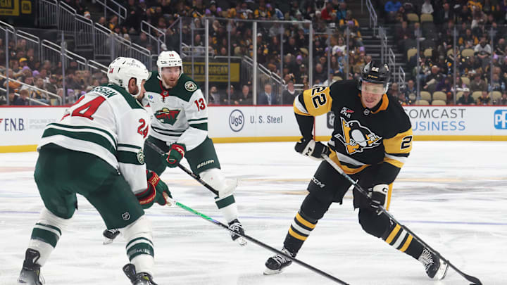 Nov 21, 2025; Pittsburgh, Pennsylvania, USA; Pittsburgh Penguins right wing Sam Poulin (22) shoots the puck as Minnesota Wild defenseman Zach Bogosian (24) defends during the third period at PPG Paints Arena. Mandatory Credit: Charles LeClaire-Imagn Images Nov 21, 2025; Pittsburgh, Pennsylvania, USA; Pittsburgh Penguins right wing Sam Poulin (22) shoots the puck as Minnesota Wild defenseman Zach Bogosian (24) defends during the third period at PPG Paints Arena. Mandatory Credit: Charles LeClaire-Imagn Images