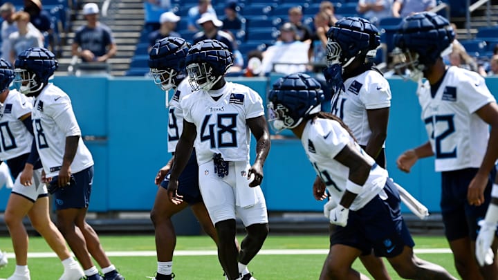 Tennessee Titans linebacker David Gbenda warms up during “Back Together Weekend” training camp practice