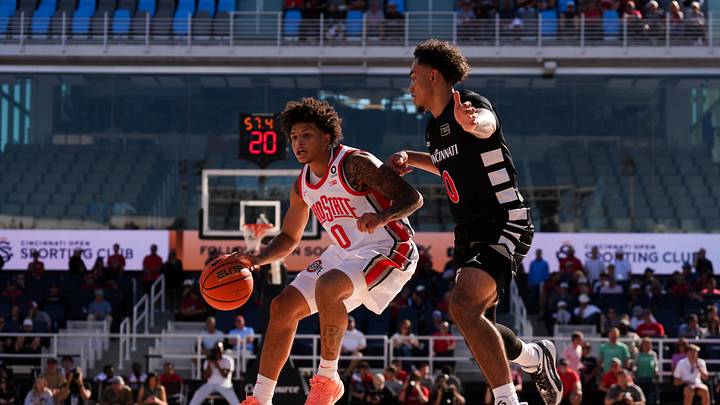 Oct 7, 2026; Mason, OH, USA;  Ohio State Buckeyes guard John Mobley Jr. (0) dribbles the ball against Cincinnati Bearcats guard Trevian Carson (0) in the first half during the 2026 CareSource Invitational at the Lindner Family Tennis Center. Mandatory Credit: Aaron Doster-Imagn Images