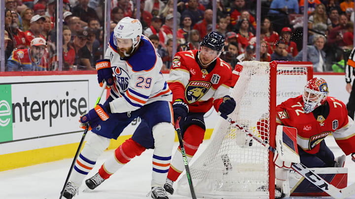 Jun 24, 2024; Sunrise, Florida, USA; Edmonton Oilers forward Leon Draisaitl (29) controls the puck against Florida Panthers defenseman Niko Mikkola (77) during the third period in game seven of the 2024 Stanley Cup Final at Amerant Bank Arena. Mandatory Credit: Sam Navarro-USA TODAY Sports