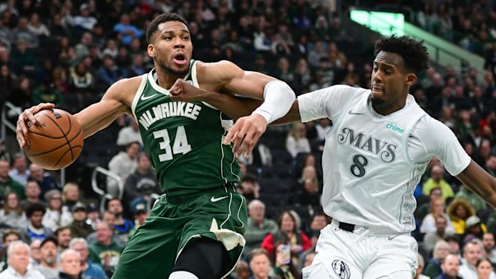Mar 5, 2025; Milwaukee, Wisconsin, USA; Milwaukee Bucks forward Giannis Antetokounmpo (34) drives for the basket against Dallas Mavericks forward Olivier-Maxence Prosper (8) in the second quarter at Fiserv Forum. Mandatory Credit: Benny Sieu-Imagn Images Mar 5, 2025; Milwaukee, Wisconsin, USA; Milwaukee Bucks forward Giannis Antetokounmpo (34) drives for the basket against Dallas Mavericks forward Olivier-Maxence Prosper (8) in the second quarter at Fiserv Forum. Mandatory Credit: Benny Sieu-Imagn Images
