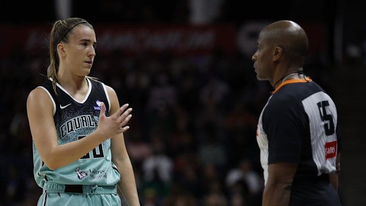 May 30, 2025; Washington, District of Columbia, USA; New York Liberty guard Sabrina Ionescu (20) talks to referee Eric Brewton (55) against the Washington Mystics in the second half at CareFirst Arena. Mandatory Credit: Geoff Burke-Imagn Images
