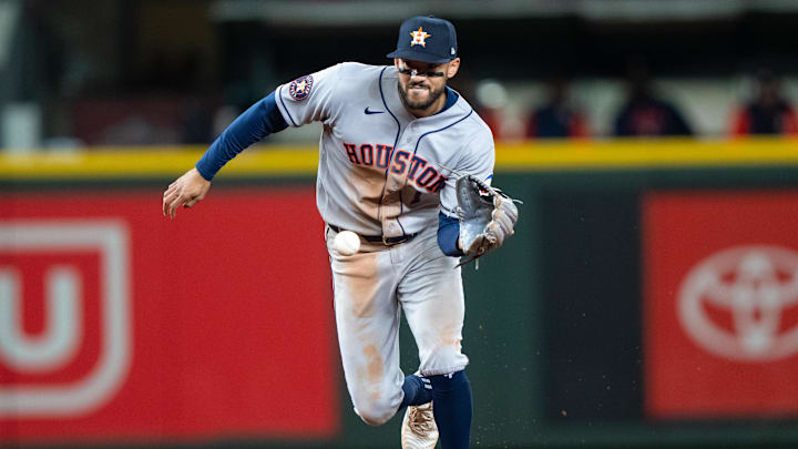 Apr 11, 2026; Seattle, Washington, USA; Houston Astros shortstop Carlos Correa (1) fields a ground ball during the eighth inning against the Seattle Mariners at T-Mobile Park. Mandatory Credit: Stephen Brashear-Imagn Images