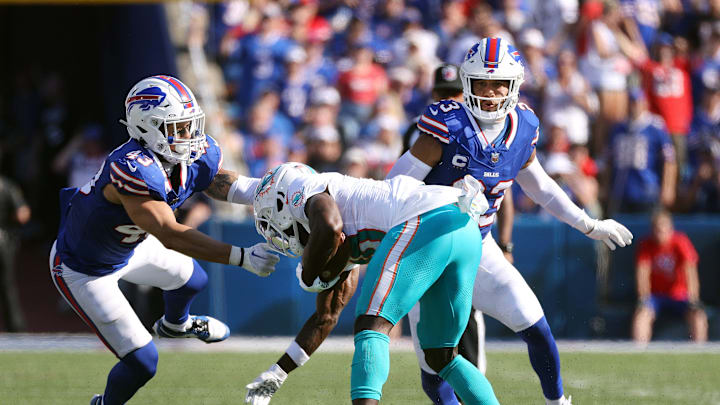 Bills defenders Terrel Bernard and Micah Hyde make the tackle on Miami receiver Tyreek Hill.