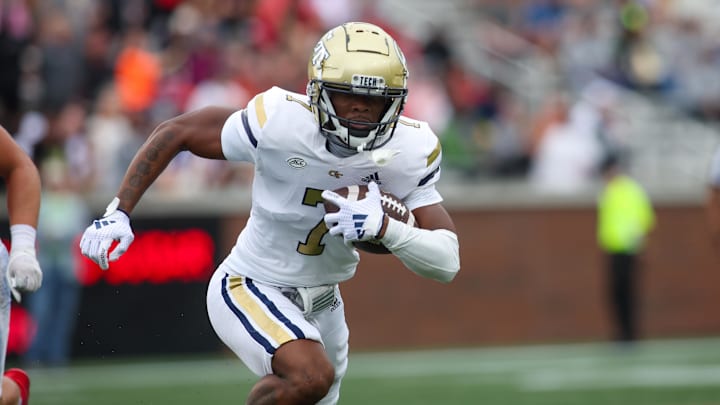 Sep 14, 2024; Atlanta, Georgia, USA; Georgia Tech Yellow Jackets wide receiver Chase Lane (7) runs after a catch against the Virginia Military Institute Keydets in the first quarter at Bobby Dodd Stadium at Hyundai Field. Mandatory Credit: Brett Davis-Imagn Images