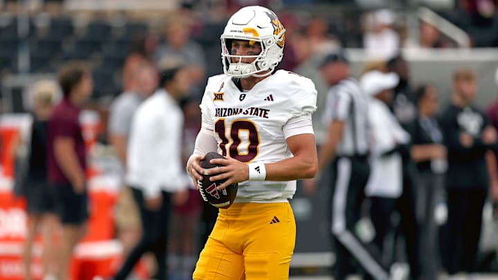 Arizona State Sun Devils quarterback Sam Leavitt (10) handles the ball during warm-ups prior to the game against Mississippi State