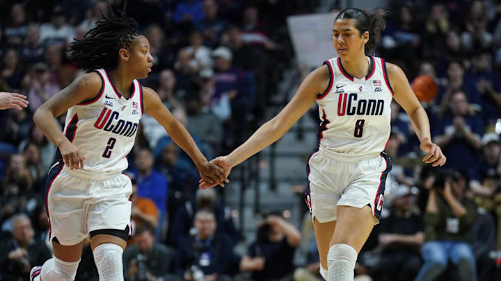 Mar 8, 2025; Uncasville, CT, USA; UConn Huskies center Jana El Alfy (8) and guard KK Arnold (2) react after a play against the St. John's Red Storm in the second half at Mohegan Sun Arena. Mandatory Credit: David Butler II-Imagn Images