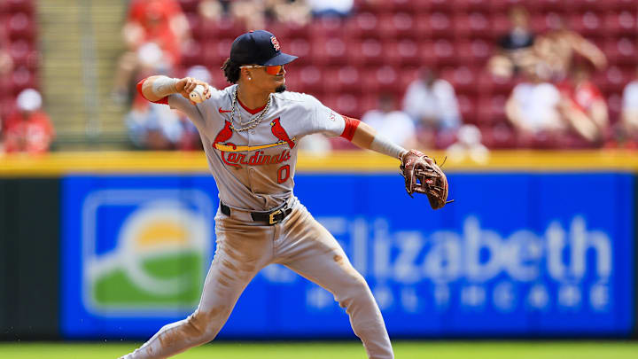Apr 30, 2025; Cincinnati, Ohio, USA; St. Louis Cardinals shortstop Masyn Winn (0) throws to first to get Cincinnati Reds second baseman Matt McLain (not pictured) out in the eighth inning at Great American Ball Park. Mandatory Credit: Katie Stratman-Imagn Images