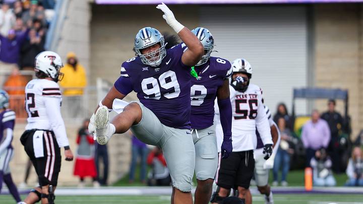 Nov 1, 2025; Manhattan, Kansas, USA; Kansas State Wildcats defensive tackle Uso Seumalo (99) celebrates a sack against Texas Tech Red Raiders quarterback Behren Morton (2) during the first quarter at Bill Snyder Family Football Stadium. Mandatory Credit: Scott Sewell-Imagn Images