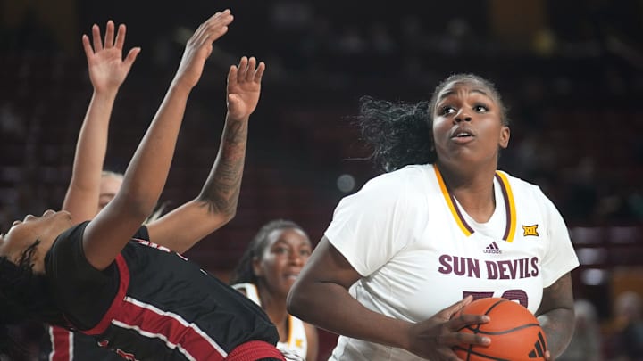 ASU Sun Devils center Nevaeh Parkinson (32) spins into the lane as Jacksonville State Gamecocks forward Asia Barclay (35) is called for a technical on her flop at Desert Financial Arena in Tempe on Nov. 4, 2024.