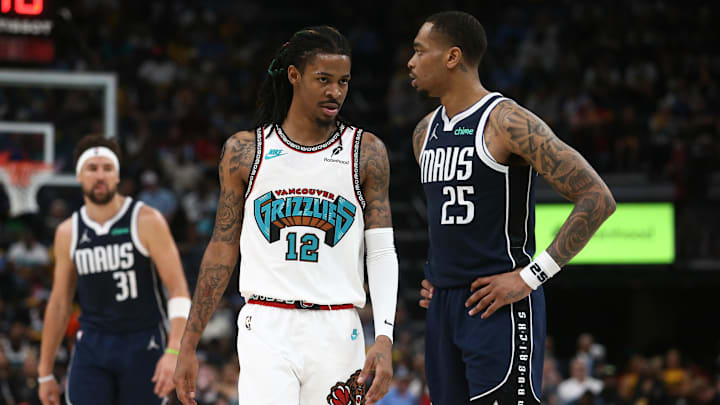 Apr 18, 2025; Memphis, Tennessee, USA; Memphis Grizzlies guard Ja Morant (12) and Dallas Mavericks forward P.J. Washington (25) look on during the fourth quarter at FedExForum. Mandatory Credit: Petre Thomas-Imagn Images