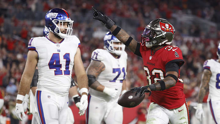 Nov 22, 2021; Tampa, Florida, USA; Tampa Bay Buccaneers safety Mike Edwards (32) intercepts the ball against the New York Giants during the second half at Raymond James Stadium. Mandatory Credit: Kim Klement-Imagn Images Nov 22, 2021; Tampa, Florida, USA; Tampa Bay Buccaneers safety Mike Edwards (32) intercepts the ball against the New York Giants during the second half at Raymond James Stadium. Mandatory Credit: Kim Klement-Imagn Images