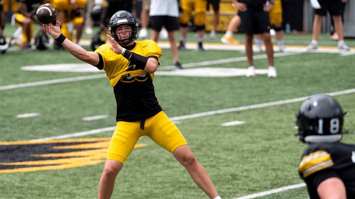 Iowa quarterback Tradon Bessinger (4) passes the football Aug. 15, 2026 during the Kids Day at Kinnick open practice at Kinnick Stadium in Iowa City, Iowa.