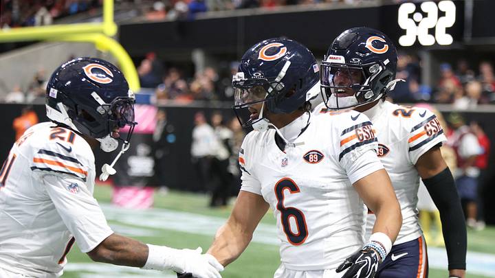 Bears defensive back Cam Lewis (left) congratulates Kyler Gordon after a pass rush against Atlanta.