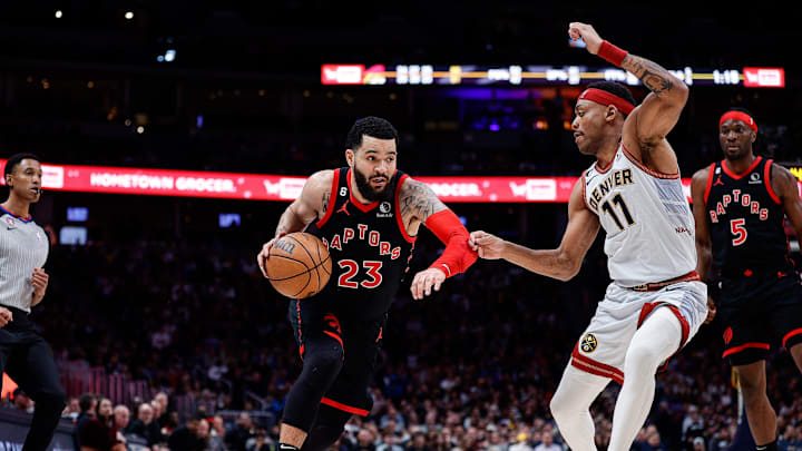Mar 6, 2023; Denver, Colorado, USA; Toronto Raptors guard Fred VanVleet (23) controls the ball as Denver Nuggets forward Bruce Brown (11) guards in the third quarter at Ball Arena. Mandatory Credit: Isaiah J. Downing-Imagn Images