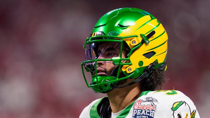 Oregon quarterback Dante Moore warms up as the Oregon Ducks face the Indiana Hoosiers in the Peach Bowl on Jan. 9, 2026, at Mercedes-Benz Stadium in Atlanta, Georgia. Oregon quarterback Dante Moore warms up as the Oregon Ducks face the Indiana Hoosiers in the Peach Bowl on Jan. 9, 2026, at Mercedes-Benz Stadium in Atlanta, Georgia.