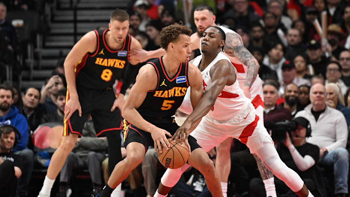 Jan 5, 2026; Toronto, Ontario, CAN;  Toronto Raptors forward RJ Barrett (9) knocks the ball from the grasp of Atlanta Hawks guard Dyson Daniels (5) in the second half at Scotiabank Arena. Mandatory Credit: Dan Hamilton-Imagn Images