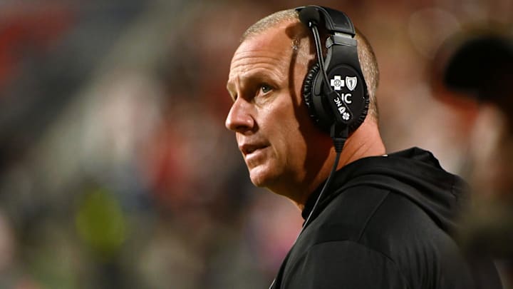 Nov 4, 2023; Raleigh, North Carolina, USA; North Carolina State Wolfpack head coach Dave Doeren looks on during the second half against the Miami Hurricanes at Carter-Finley Stadium.  Mandatory Credit: Rob Kinnan-Imagn Images