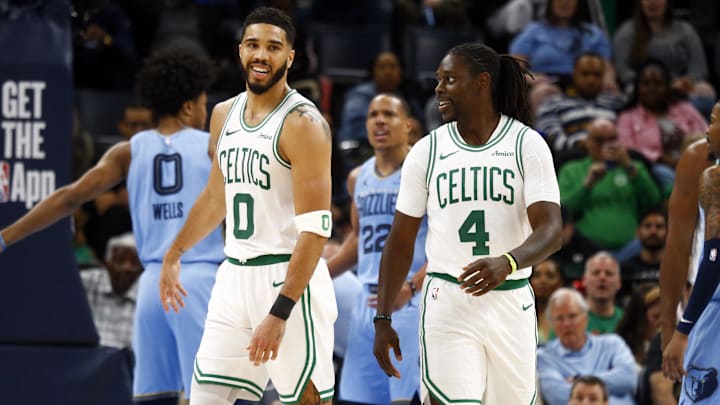 Mar 31, 2025; Memphis, Tennessee, USA; Boston Celtics forward Jayson Tatum (0) reacts with Boston Celtics guard Jrue Holiday (4) during the third quarter against the Memphis Grizzlies at FedExForum. Mandatory Credit: Petre Thomas-Imagn Images