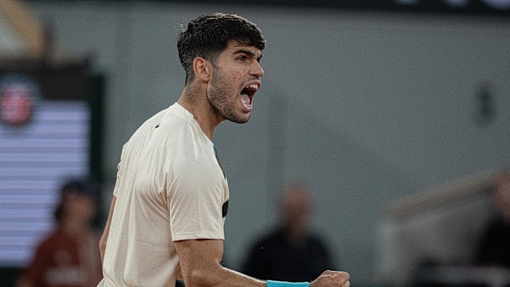 Carlos Alcaraz of Spain reacts to a point during his match against Lorenzo Musetti of Italy match on day 13 at Roland Garros Stadium.