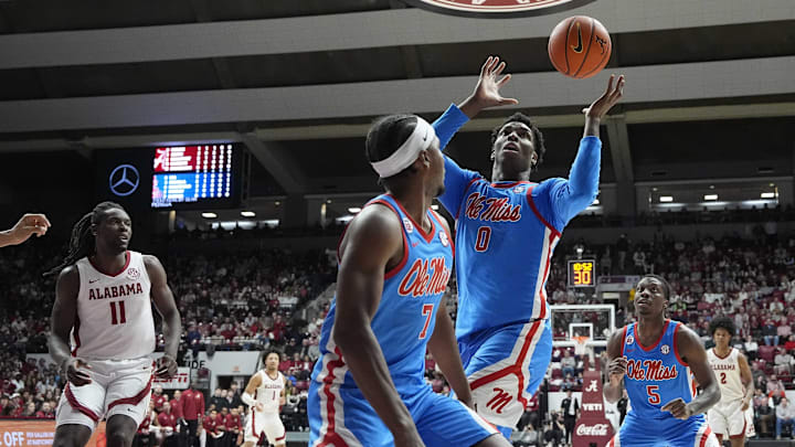Jan 14, 2025; Tuscaloosa, AL, USA;  Ole Miss forward Malik Dia (0) grabs a rebound against Alabama at Coleman Coliseum. Mandatory Credit: Gary Cosby Jr.-USA TODAY Network via Imagn Images