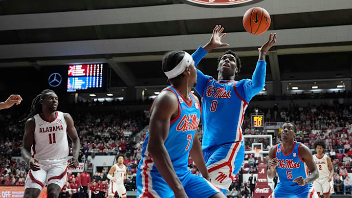 Jan 14, 2025; Tuscaloosa, AL, USA; Ole Miss forward Malik Dia (0) grabs a rebound against Alabama at Coleman Coliseum. Mandatory Credit: Gary Cosby Jr.-Tuscaloosa News Jan 14, 2025; Tuscaloosa, AL, USA; Ole Miss forward Malik Dia (0) grabs a rebound against Alabama at Coleman Coliseum. Mandatory Credit: Gary Cosby Jr.-Tuscaloosa News