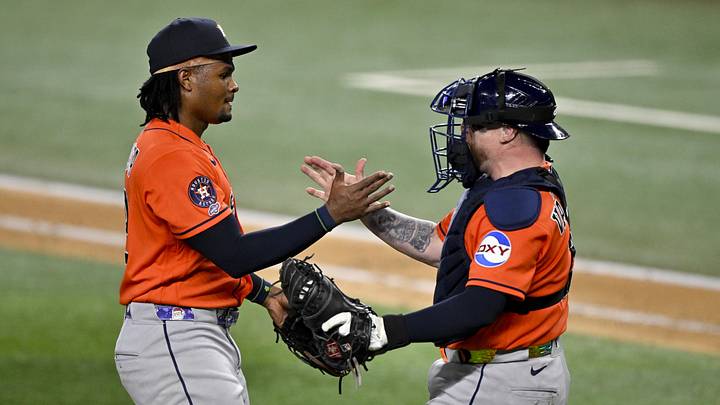 May 25, 2026; Arlington, Texas, USA;  Houston Astros relief pitcher Alimber Santa (72) and catcher Christian Vazquez (2) celebrate on the field after the Astros pitch a combined no hitter against the Texas Rangers at Globe Life Field. Mandatory Credit: Jerome Miron-Imagn Images