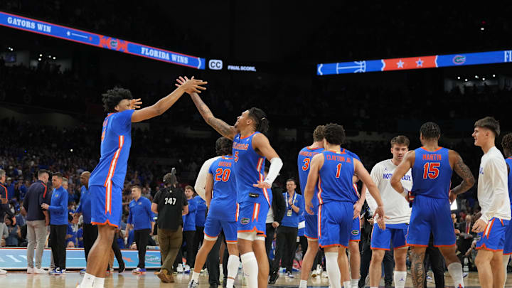 Apr 5, 2025; San Antonio, TX, USA;  Florida Gators players celebrate after defeating the Auburn Tigers in the semifinals of the men's Final Four of the 2025 NCAA Tournament at the Alamodome. Mandatory Credit: Robert Deutsch-Imagn Images