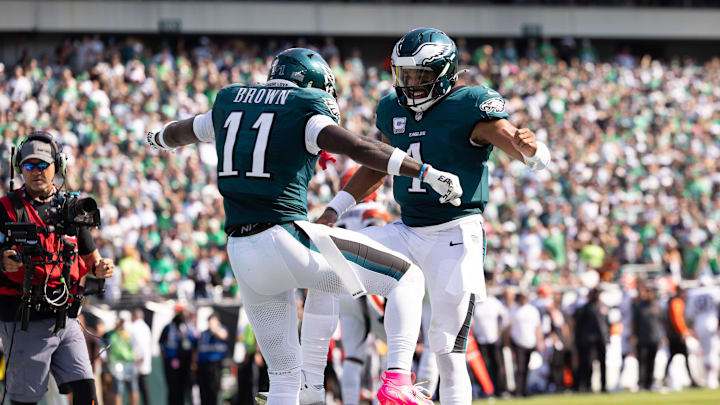Oct 13, 2024; Philadelphia, Pennsylvania, USA; Philadelphia Eagles quarterback Jalen Hurts (1) and wide receiver A.J. Brown (11) celebrate their touchdown pass during the second quarter against the Cleveland Browns at Lincoln Financial Field. Mandatory Credit: Bill Streicher-Imagn Images Oct 13, 2024; Philadelphia, Pennsylvania, USA; Philadelphia Eagles quarterback Jalen Hurts (1) and wide receiver A.J. Brown (11) celebrate their touchdown pass during the second quarter against the Cleveland Browns at Lincoln Financial Field. Mandatory Credit: Bill Streicher-Imagn Images