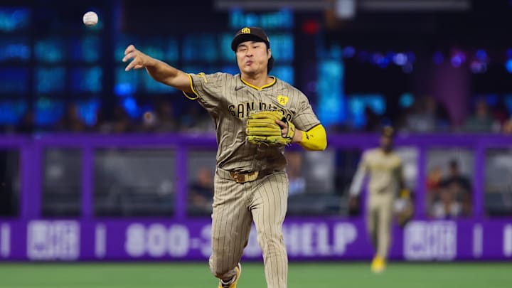 Aug 11, 2024; Miami, Florida, USA; San Diego Padres shortstop Ha-Seong Kim (7) turns a double play against the Miami Marlins during the fifth inning at loanDepot Park.