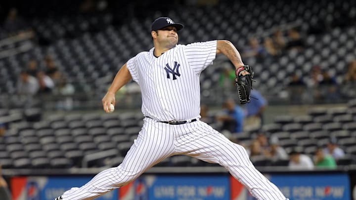 New York Yankees relief pitcher Joba Chamberlain (62) pitches against the Los Angeles Angels during the ninth inning at Yankee Stadium in 2013. New York Yankees relief pitcher Joba Chamberlain (62) pitches against the Los Angeles Angels during the ninth inning at Yankee Stadium in 2013.