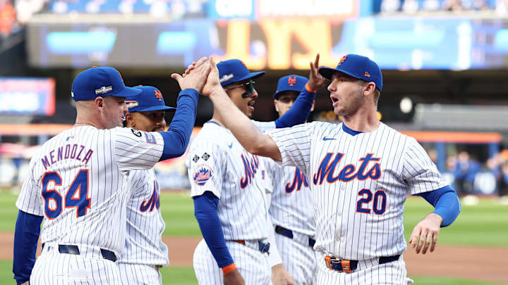Oct 8, 2024; New York City, New York, USA; New York Mets first baseman Pete Alonso (20) greets manager Carlos Mendoza (64) before game three against the Philadelphia Phillies in the NLDS for the 2024 MLB Playoffs at Citi Field. Mandatory Credit: Vincent Carchietta-Imagn Images Oct 8, 2024; New York City, New York, USA; New York Mets first baseman Pete Alonso (20) greets manager Carlos Mendoza (64) before game three against the Philadelphia Phillies in the NLDS for the 2024 MLB Playoffs at Citi Field. Mandatory Credit: Vincent Carchietta-Imagn Images