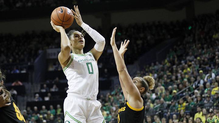 Feb 9, 2020; Eugene, Oregon, USA; Oregon Ducks forward Satou Sabally (0) shoots the ball over Arizona State Sun Devils guard Taya Hanson (right) during the first half at Matthew Knight Arena. Mandatory Credit: Soobum Im-Imagn Images