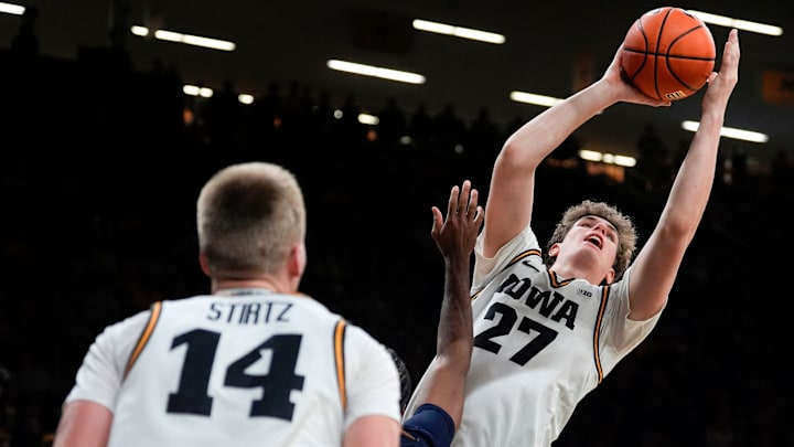Iowa center Trevin Jirak (27) catches a pass from Iowa guard Bennett Stirtz (14) and looks to score against the Xavier Musketeers Nov. 14, 2025 at Carver-Hawkeye Arena in Iowa City, Iowa. Iowa center Trevin Jirak (27) catches a pass from Iowa guard Bennett Stirtz (14) and looks to score against the Xavier Musketeers Nov. 14, 2025 at Carver-Hawkeye Arena in Iowa City, Iowa.